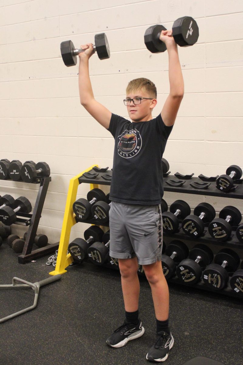 Sophomore Colin Harris lifts during his advanced weights class with Mr. Best.