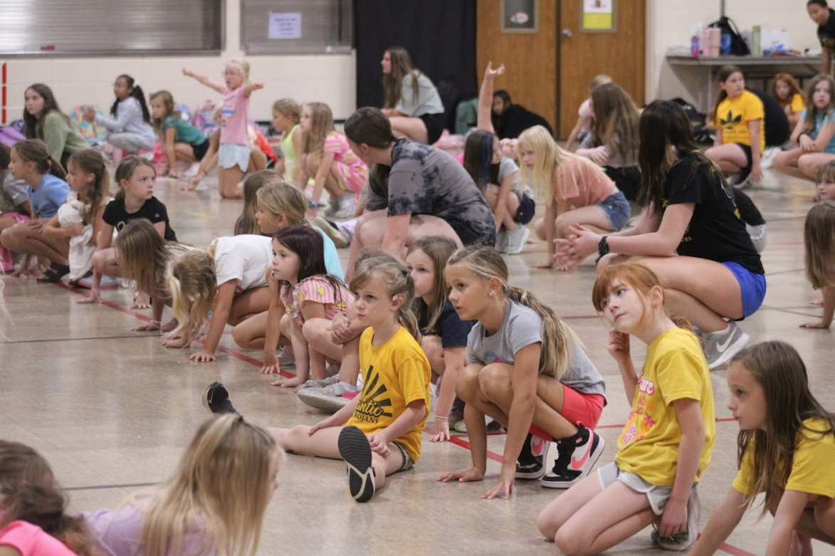 2nd and 3rd cheer clinic practices their routine.