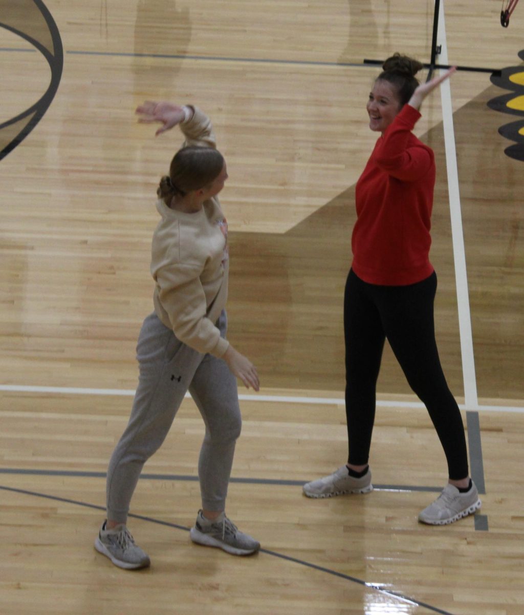 Juniors Claire Schroder and Aubrey Winford celebrate the scores they got during archery in Mrs. O'Hara's p.e. class!