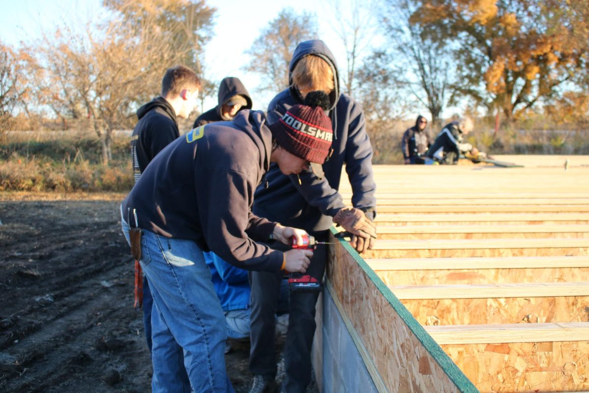 Seniors Talon Lajeuness and David Retallic help build a house for their building and trades class. They plan on selling the house once they are finished!