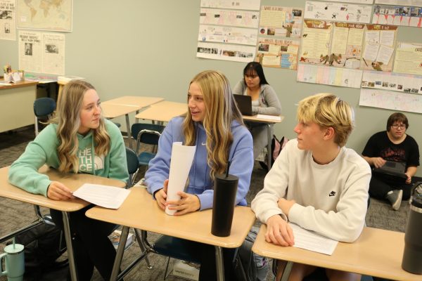 DEBATE-- Sophomores (left to right) Peyton Burg, Peyton McLaren, and Dane Wiederstein prepare for their debate for World History Class. 