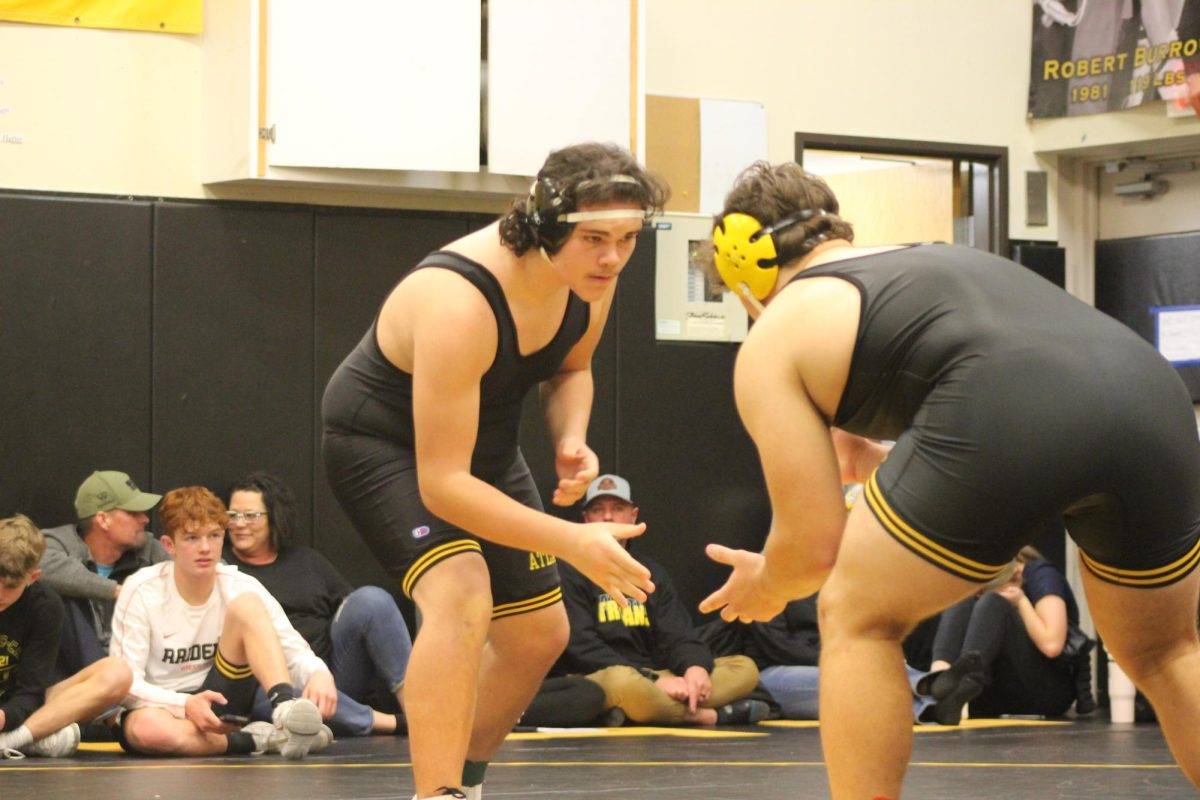 Freshman Yzechiel Jimenez wrestles senior Evan Sorensen. Sorensen then picked up Jimenez and lightly dropped him on the mat. Sorensen then pinned Jimenez shortly after. 