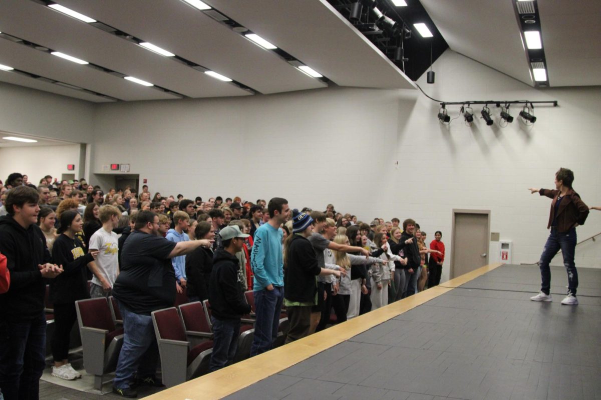 Students and teachers dance together to the "Y.M.C.A.,"  being led by Desi Payne. Behind Payne, there are a few students that were chosen to help lead. The joy radiating off of the crowd prompted Payne to compliment AHS. She told the room, "This is one of the most respectful schools I have been to."