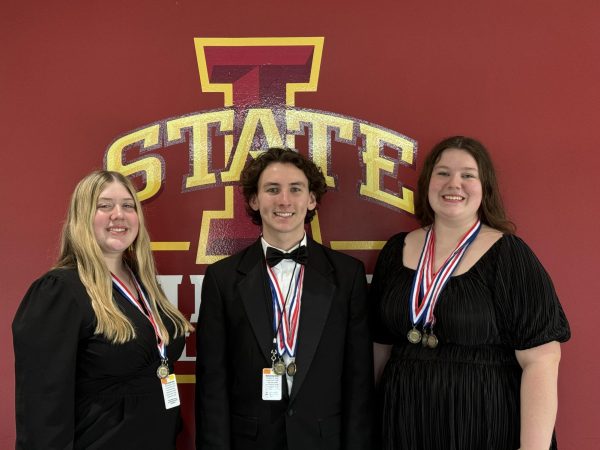 The 2024 Atlantic band All-Staters. Seniors Brady Wagner and Drayce Moore, and junior Grace Mitchell, were accompanied by two choir students - Danielle Bennett and Zephyr Mitchell - on their journey to All State. As indicated by the medals, it was Wagner's first time qualifying, Moore's second time qualifying, and G. Mitchell's third time qualifying.