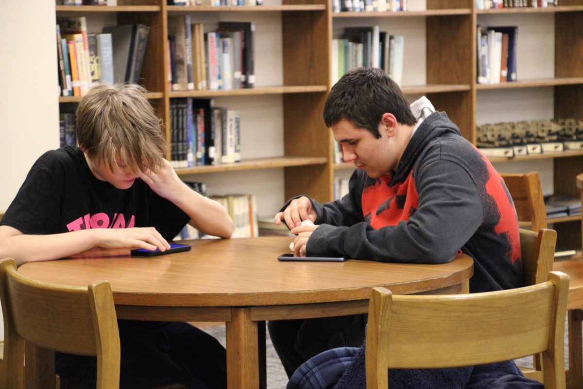 STEREO MADNESS - Christopher Shinkle and Aiden Crawford play Geometry Dash on their phones. Shinkle recommended the game to Crawford, and after some coaxing, he decided to try it out. After playing the first level, Stereo Madness, Crawford decided to attempt some other levels, too.