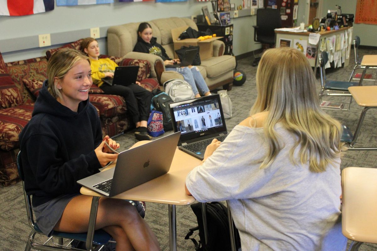 HARD AT WORK-- Senior Anna Potts and Sophomore Maddie Myers work on Spanish 2 homework in Sr. Vargason's AO. 