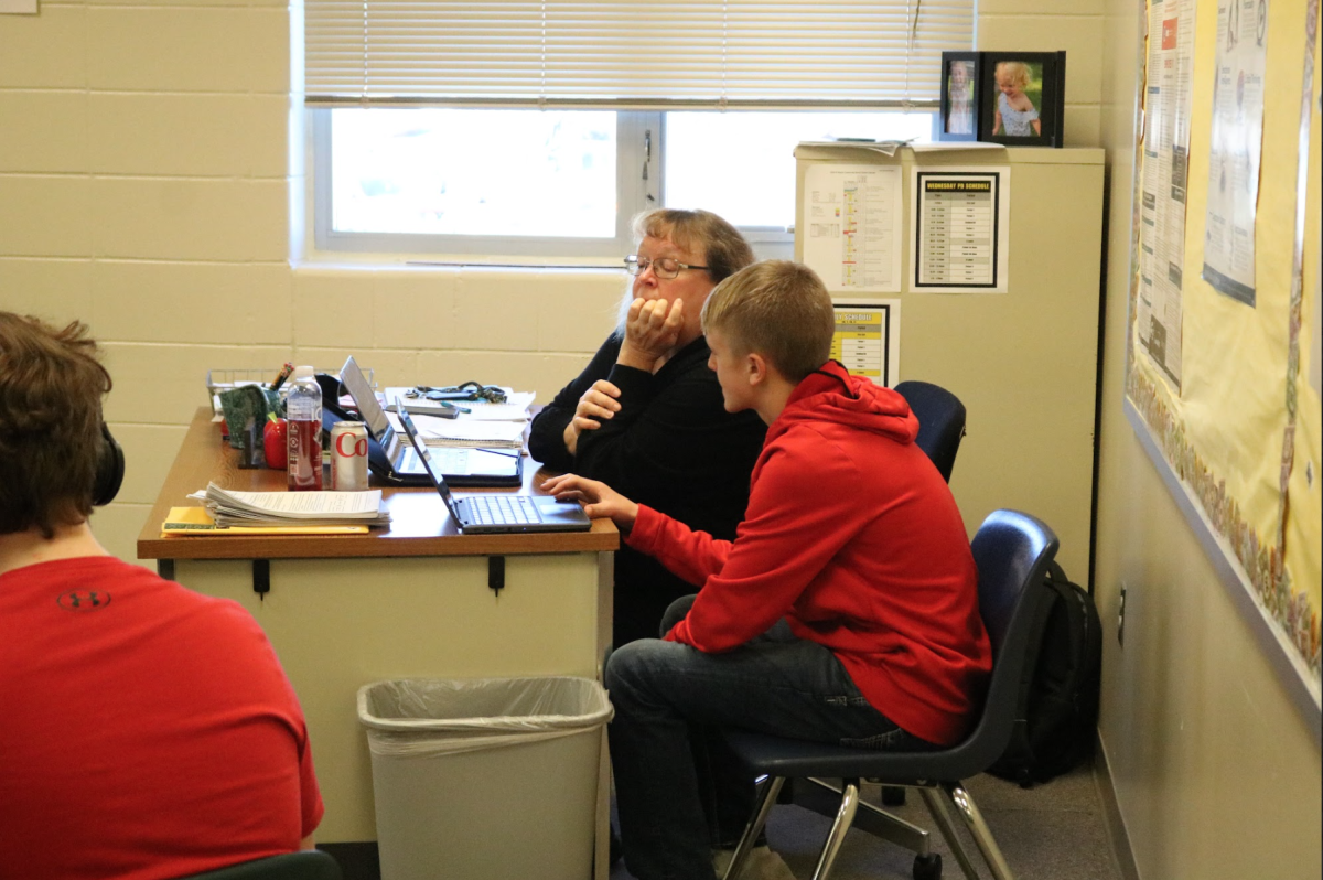 Teacher Mary Jensen helps Keaton Schroeder understand the assignment. Schroeder had some questions about the assignment. He went to Jensen to have her look over his work. 