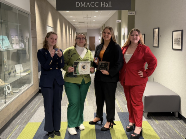 Students competing at the 2025 IHSSA State Debate Tournament stand with their awards. PHOTO CREDIT: Speech and Debate Coach Trisha Koenig