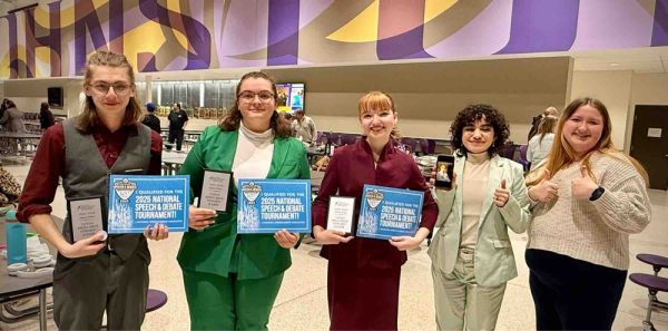 Competitors from the NSDA National Qualifier Tournament stand with their awards after the tournament. Photo Credit: Coach Trisha Koenig