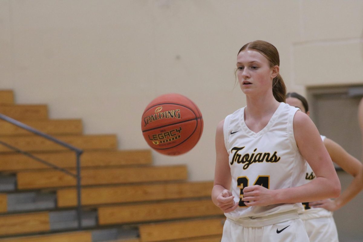 Girls basketball players stand strong, but the student section has not been as strong in supporting them.