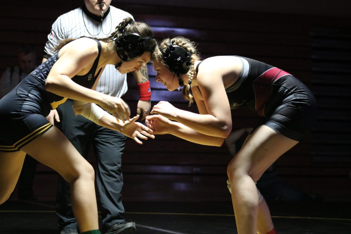 HEAD TO HEAD- Junior Lily Johnson stares down her opponent. Johnson intimated her opposer. She ended up winning the match.