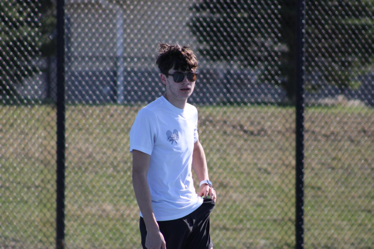 Conner Johnson is ready to play. He has had a great season and is very proud of how far he has come. He is happy with how his senior year of tennis is ending and couldn't have asked for a better group of people to play with. 