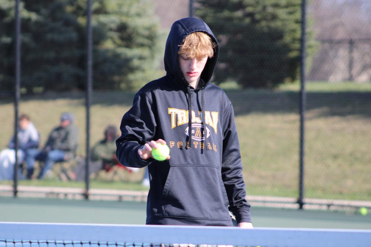 Kinnick Juhl battles through the weather. Although the match was cold and windy he had a good time and played very well. Juhl feels like he has improve over the season and hopes to make it to state this year. 