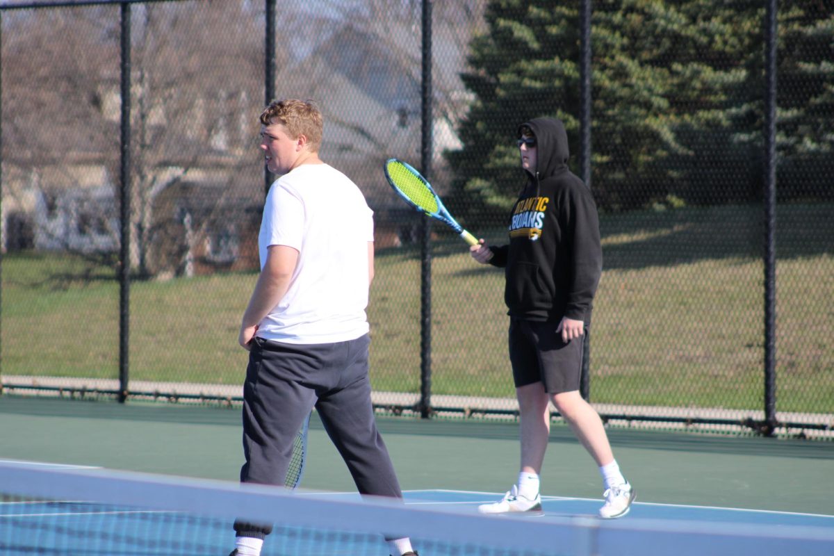 Reid Woodward and Zayden Parker play doubles in the cold. Although it was not a very nice day for tennis, the boys worked well together. They played hard and communicated well on the court. 