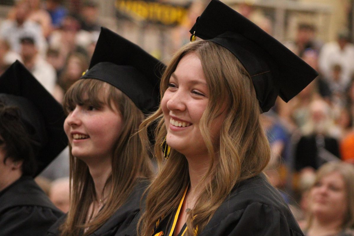 Jody Williams and Emma Winford smiling and laughing during Mr. Peterson's speech. Both remembering the past memories that were created at AHS. Peterson talked about all different types of things such as memories and advice. 