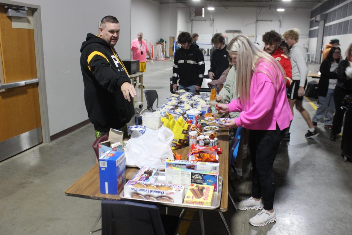 CCEOC students are served treats for their Halloween party.