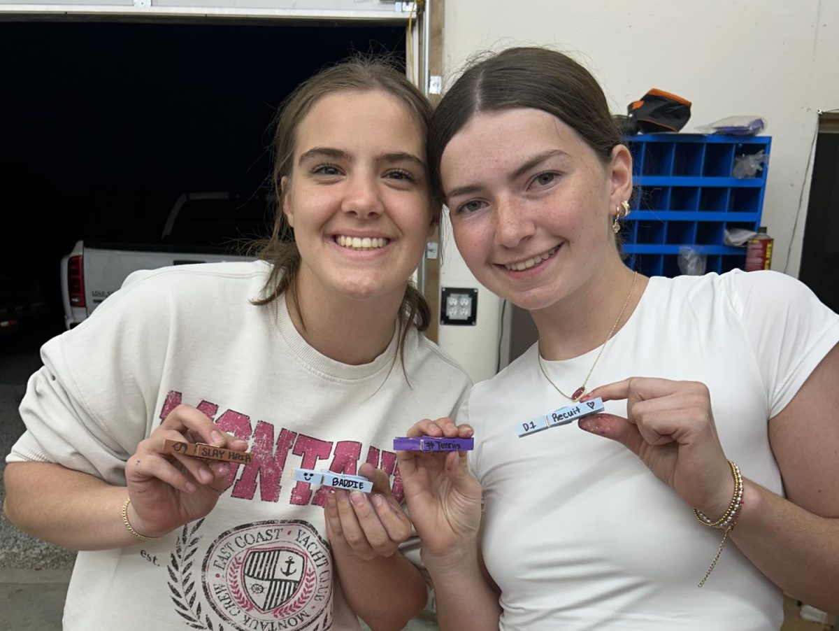 #CLIPPED- Sophia Rose and Dylin Ball decorate clothes pins. They had a great time and also had the help from Lily Willrich to make them for a tennis tournament. They said it was super fun to see everyone's reactions when they got clipped. 