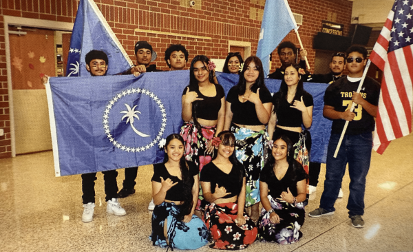 A group photo of student Islander representatives after the 2023 homecoming pep rally.
