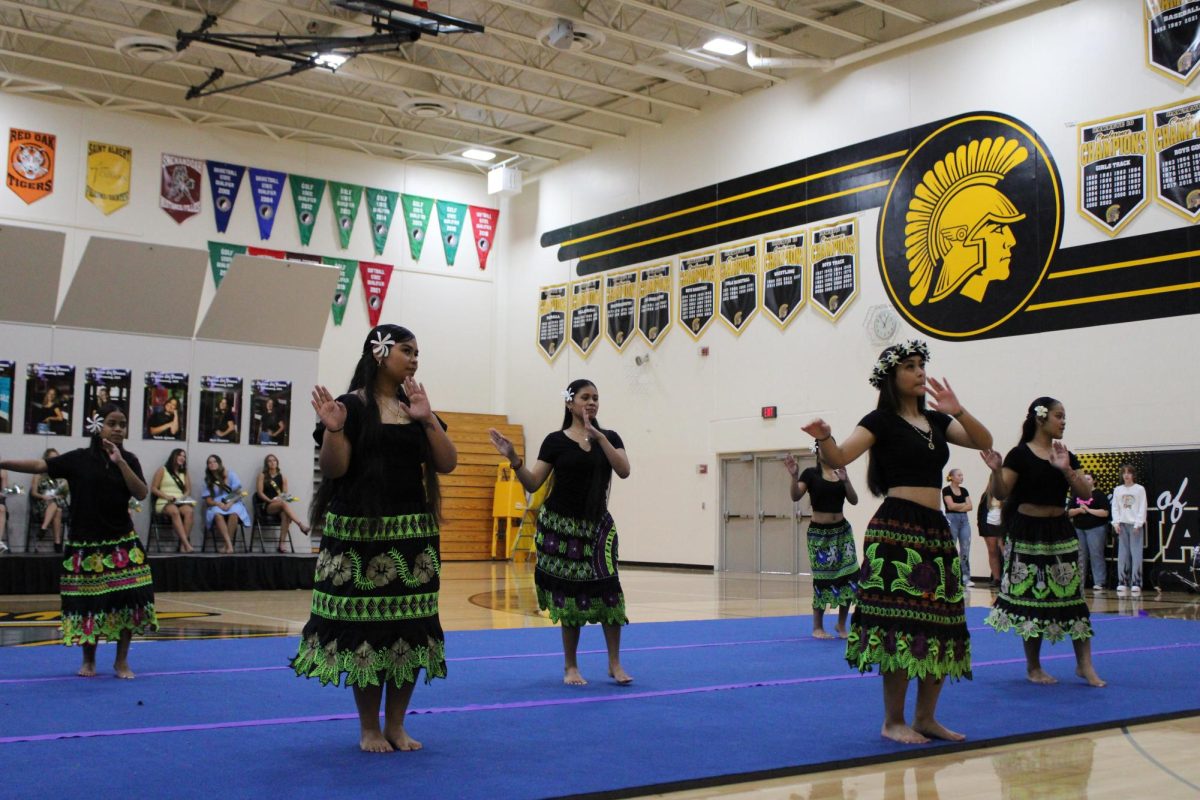 Hula dancers perform at the 2024 homecoming pep rally. 