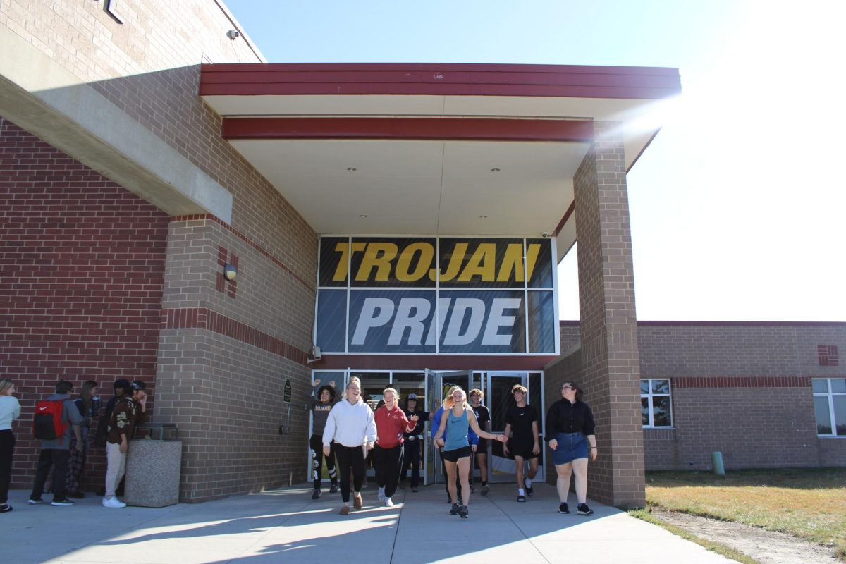 Seniors exit AHS on a sunny day.
