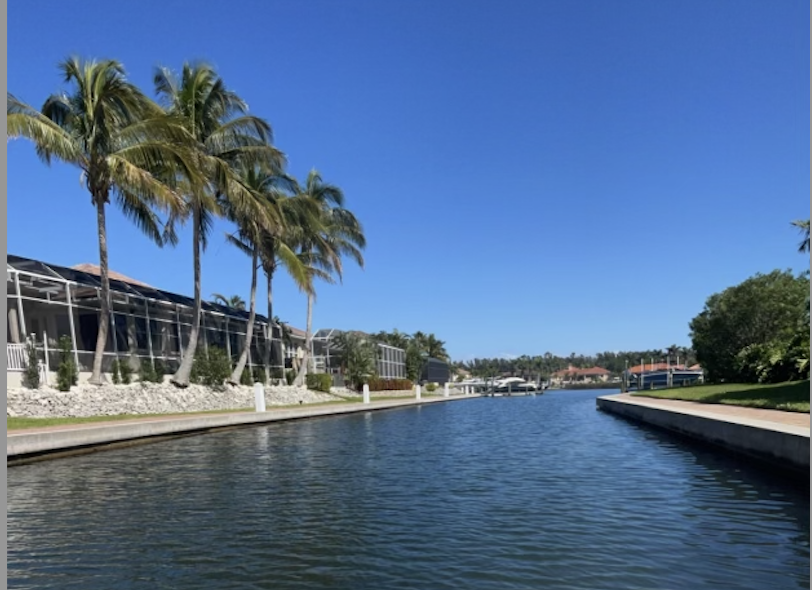 VIEW FROM THE BOAT - Palm trees line the waterway in Anna Maria, Fla. 