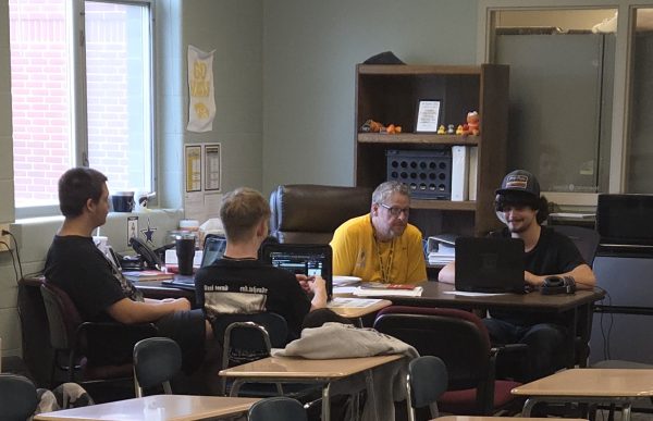 Derek Handle helps the EOC students in their new room. 