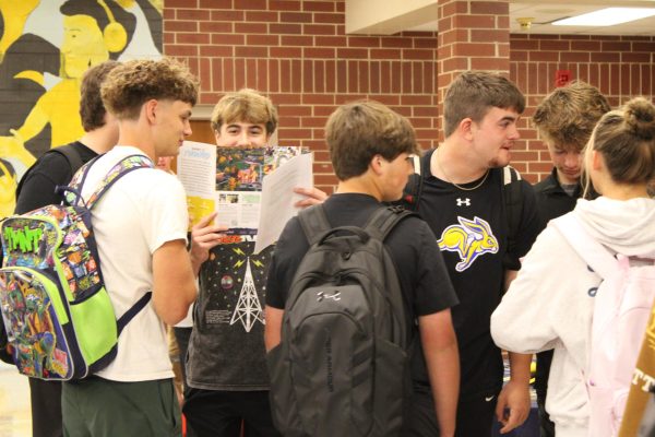 Corbin Ritter, Sawyer Tarrel, Gavin McLaren, and Sam Brosam congregate to talk about the college tables they have stopped by.