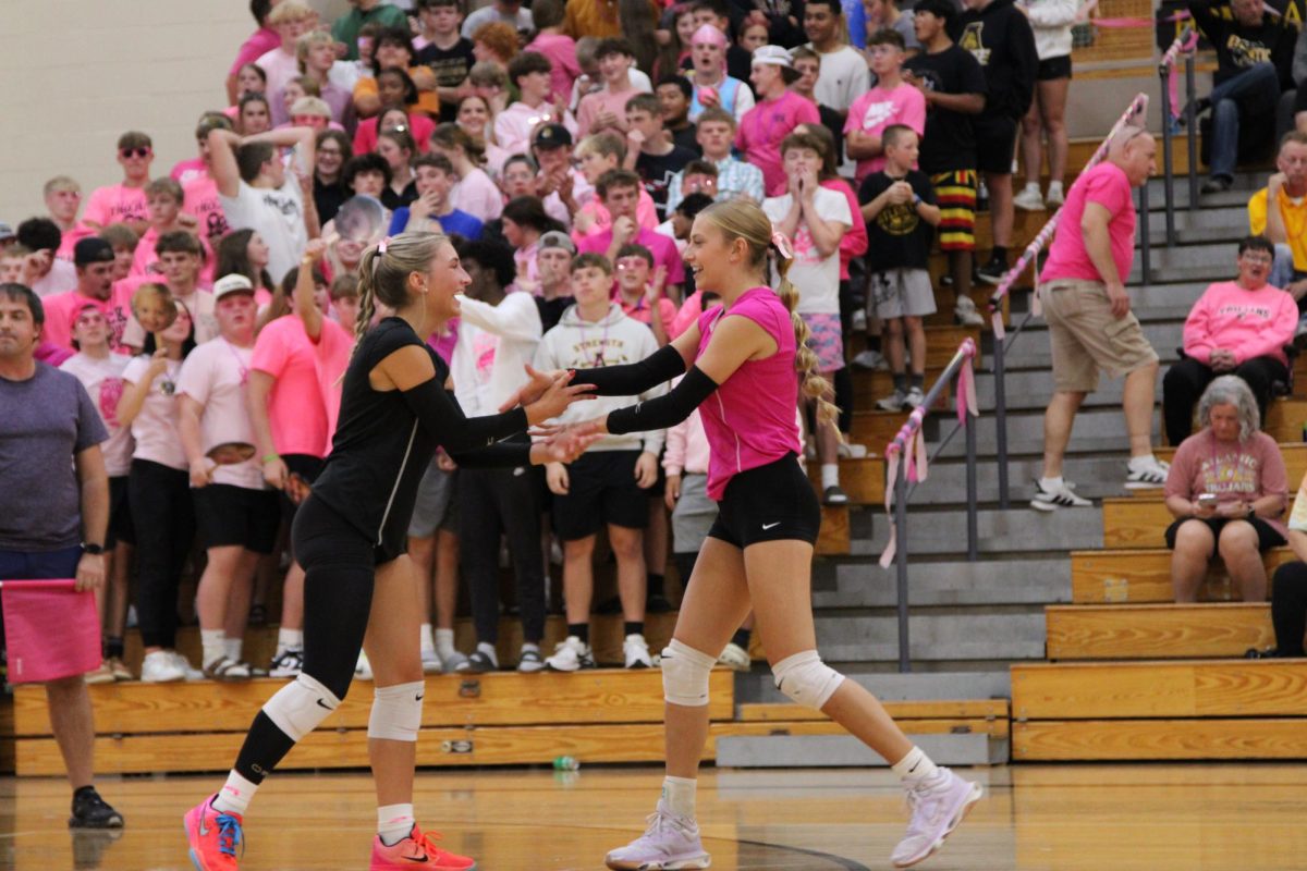 Friendship on and off the court. Taylee Hagen and Peyton McLaren created a handshake, and shared smiles on the court. 