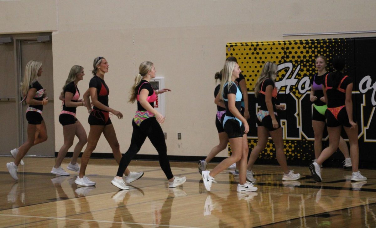 Senior girls playing dodgeball in their swimsuits. 