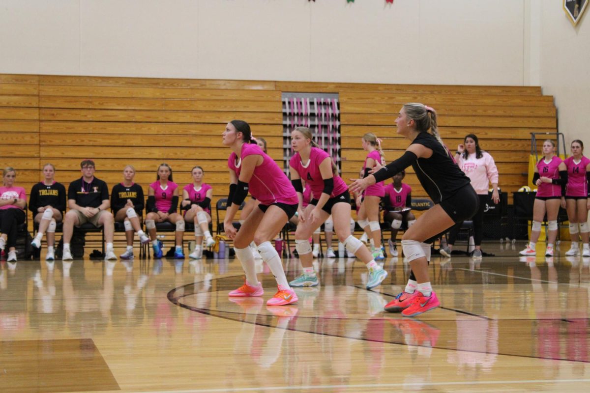 Reese Harlan receives a serve from St. Albert, and gives the setter a beautiful pass. Claire Schroder and Taylee Hagen talked to Harlan on the court to help her out. 
