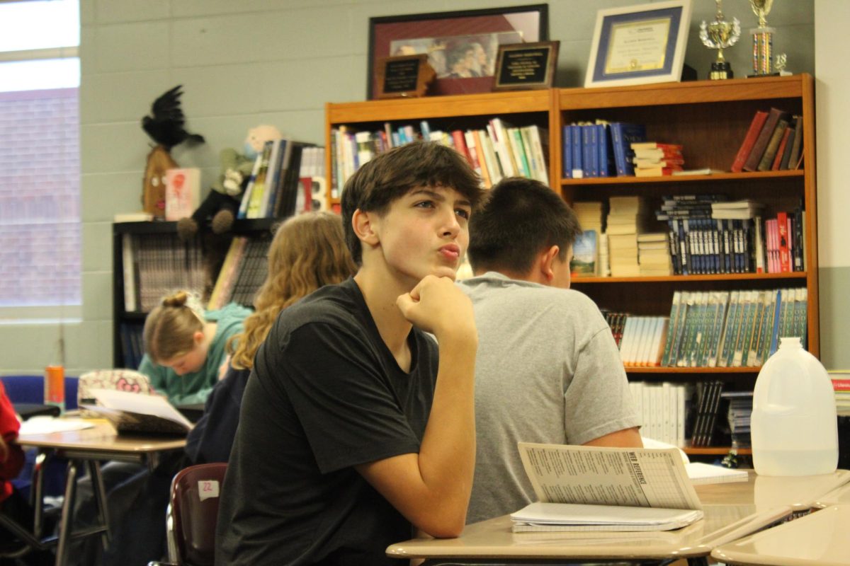 Draven Wheeler is posing for the camera in 2nd period Mrs.Berryhills class.
