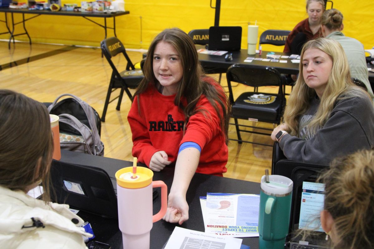Aubrey Winford finishes her blood donation with a smile. Her friends waited for their turn.