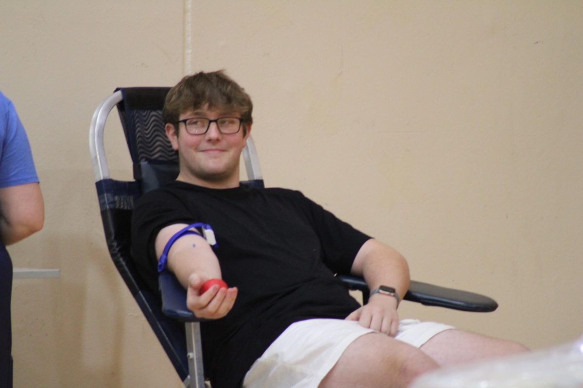 Smile for the camera
Rayden Wheeler is getting his blood taken out for the blood drive and he is smiling when he saw the camera.