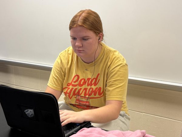 Senior MJ Blake listens to music while she does her work.
