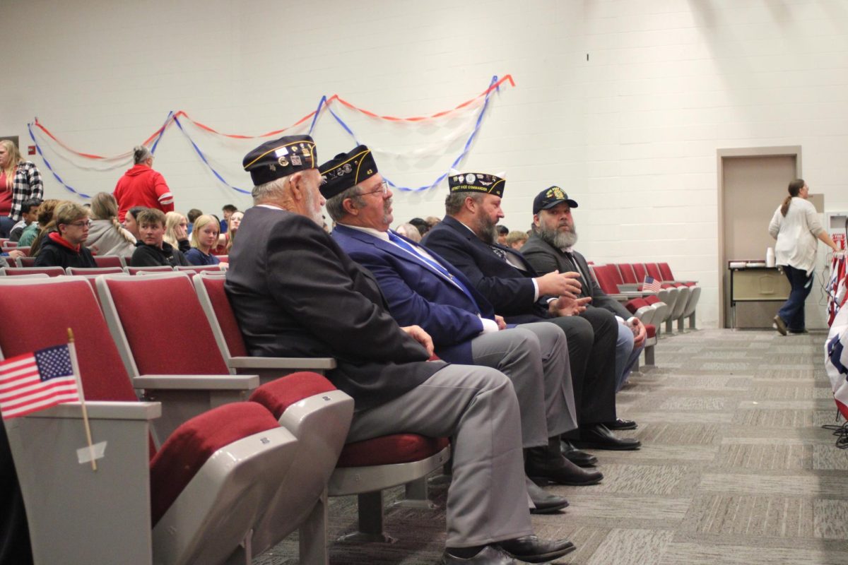 Veterans players watch as the students of Atlantic High School honor them with the playing of the medley. Band students learned and played the medley over a couple weeks. Choir members also practiced and perfected the National Anthem.