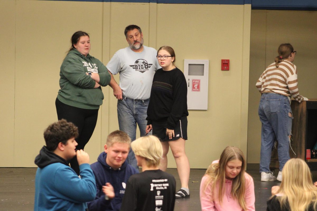 The Mean Girls Musical cast is preparing for their upcoming performance. Mark Anderson instructs Grace Mitchel and Alana Petersen with some pointers. 