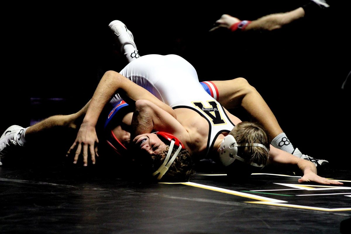 Sophomore Keaton Schroeder takes on   freshman from Earlham. Schroeder won the Match.