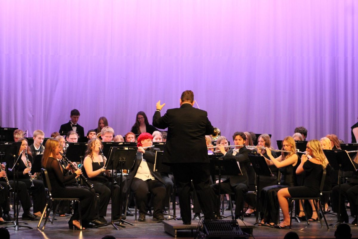 Mr. O'Donnell conducts the dramatic build up of "Shenendoah." As the band played, the audience sat upright in their seats. 