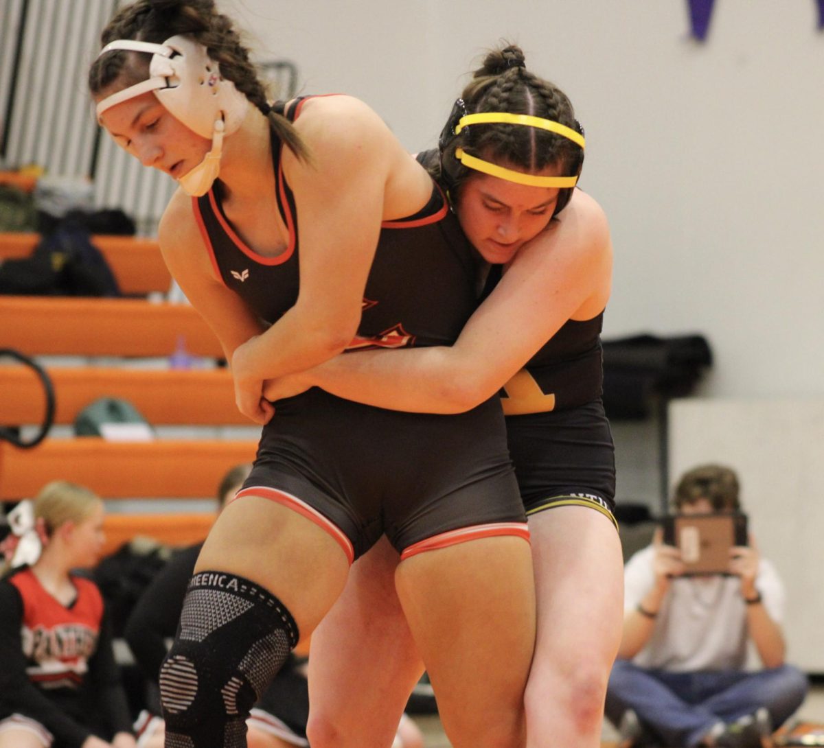 Junior Alivia Knuth is in her second season of girls wrestling with AHS. Both girls on their feet, who will get the other down first?