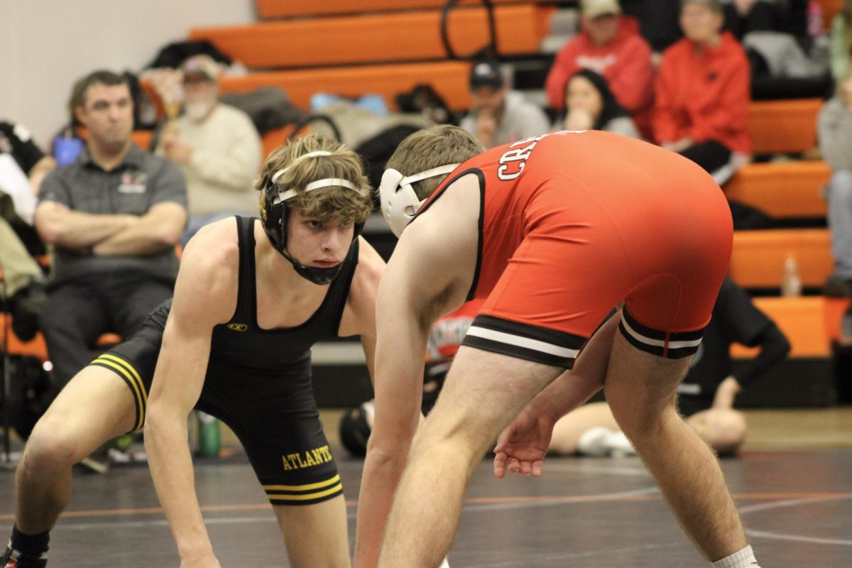 Senior Braxton Hass stares into the eyes of his opponent from Creston, ready to fight for a good match. Hass is a strong senior wrestler and a guy you will want to watch on the mat.