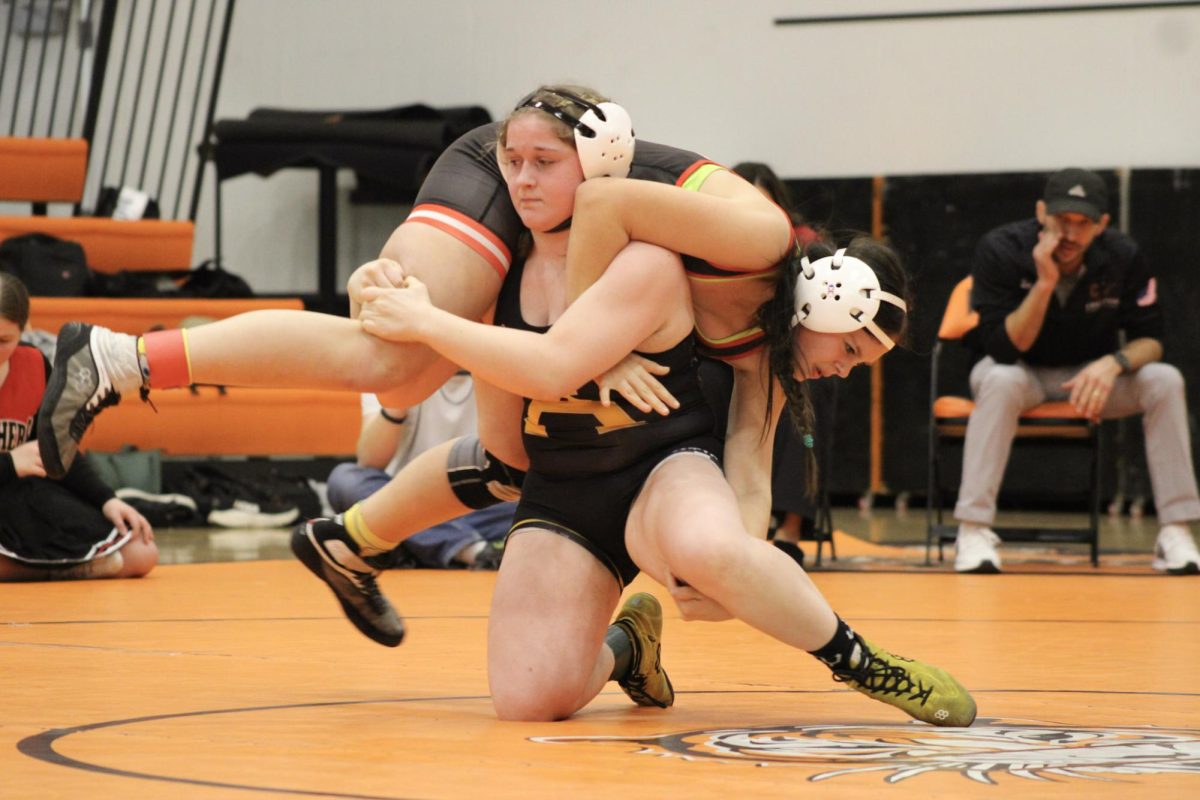 Sophomore Leiah Thomas swings her opponent around twice before laying her down to the mat. Thomas is on her up this season and continues to excel on and off the mat.