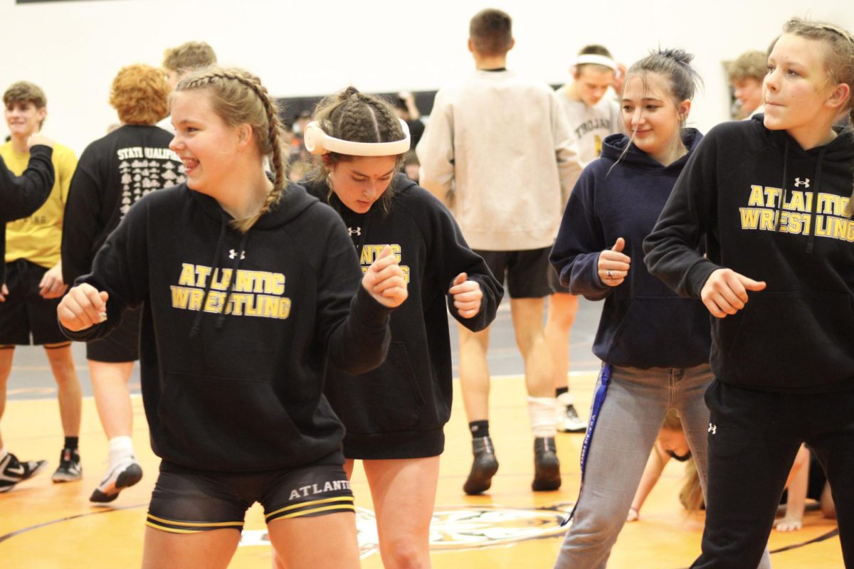 A little party never killed nobody. The Atlantic girls wrestling team dance at their triangular meet in Red Oak and get ready to kick off the meet. Moving and grooving to a pre-meet playlist the wrestlers move to the music. Pictured is Josie Miller, Alivia Knuth,Willow Drake and manager Tiegan Daniel