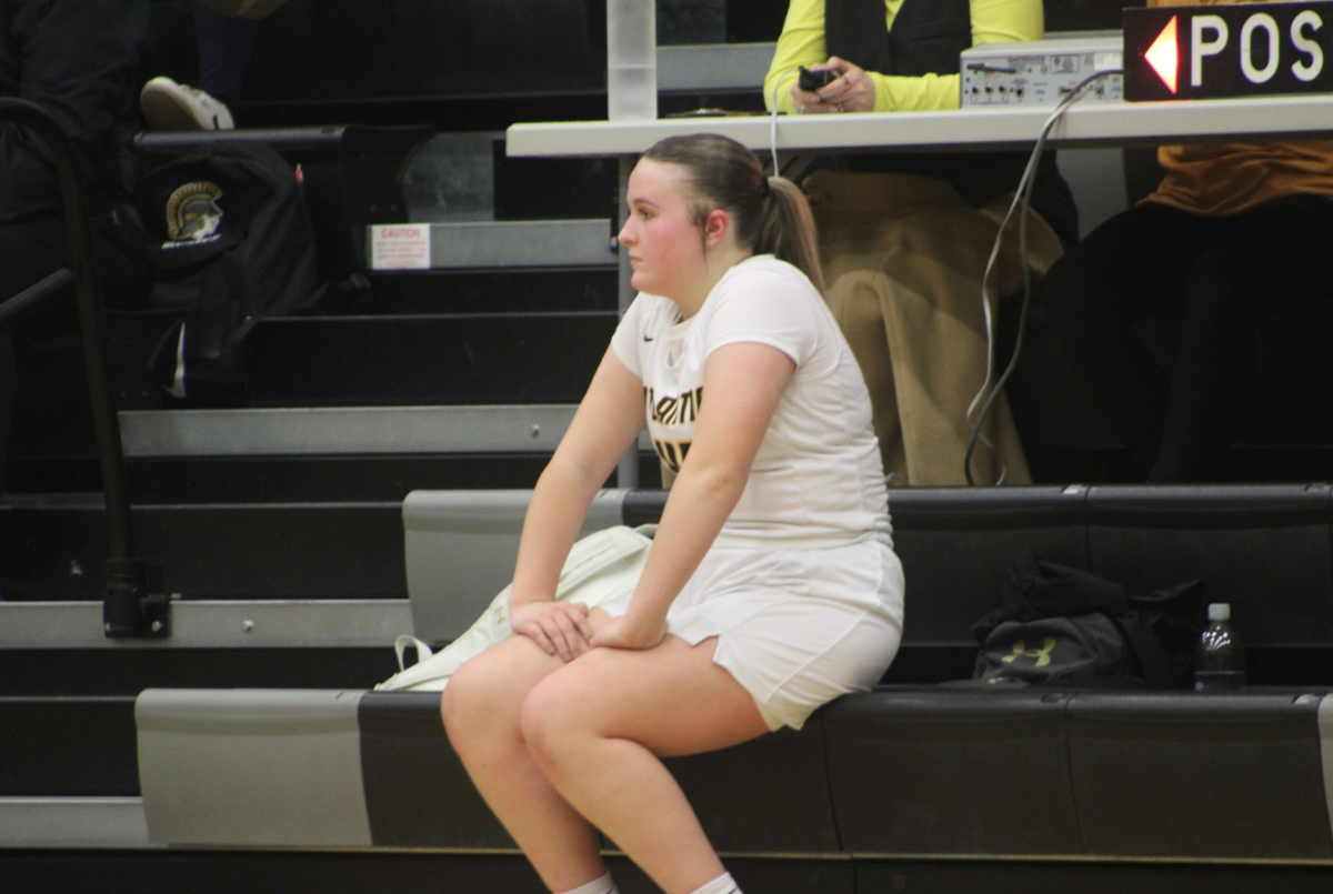 Freshman Addison Meads watches her teammates, preparing to sub in. 