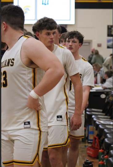 Trojans shake hands with the Comets at the conclusion of the game. After a devestating defeat Corbin Ritter showed good sportsmanship after a loss. Ritter congratulated the opposing team. 