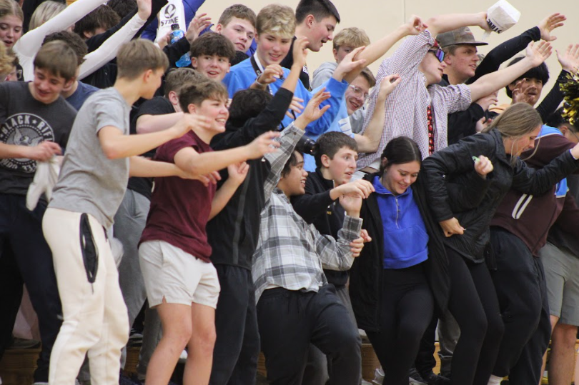 The Trojan student section leans as the cheerleaders lead a crowd cheer. Lots of laughs and giggles came from these cheers as people leaned to hard so fellow peers fell. 