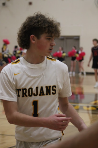 Player #1 Gage Gross walks to receive the ball. Junior Gross caught his breath after a long series of plays before the half ended.