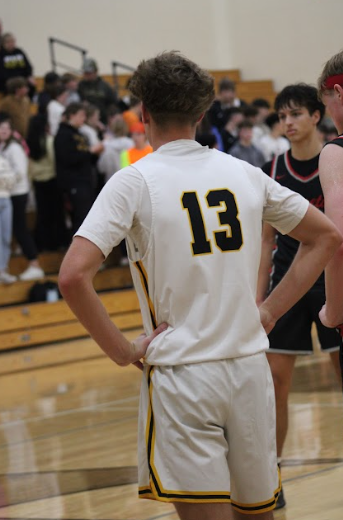 Corbin Ritter waits for the other team to shoot their free throw. Opponent North Polk prepared for a player to shoot a shot after he got fouled. 