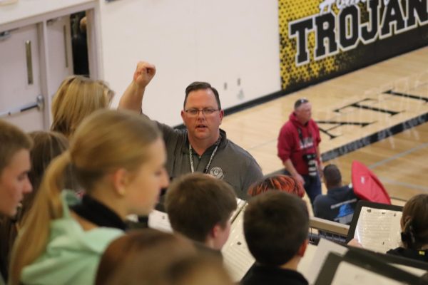 Jarrod O'Donnell conducts the band during half time. Most of the songs were relatively fast paced, so the accuracy and timing of his conducting were paramount in keeping the band together.