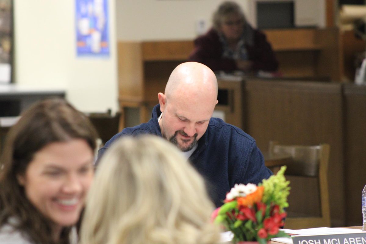 Josh McLaren prepares for a school board meeting.