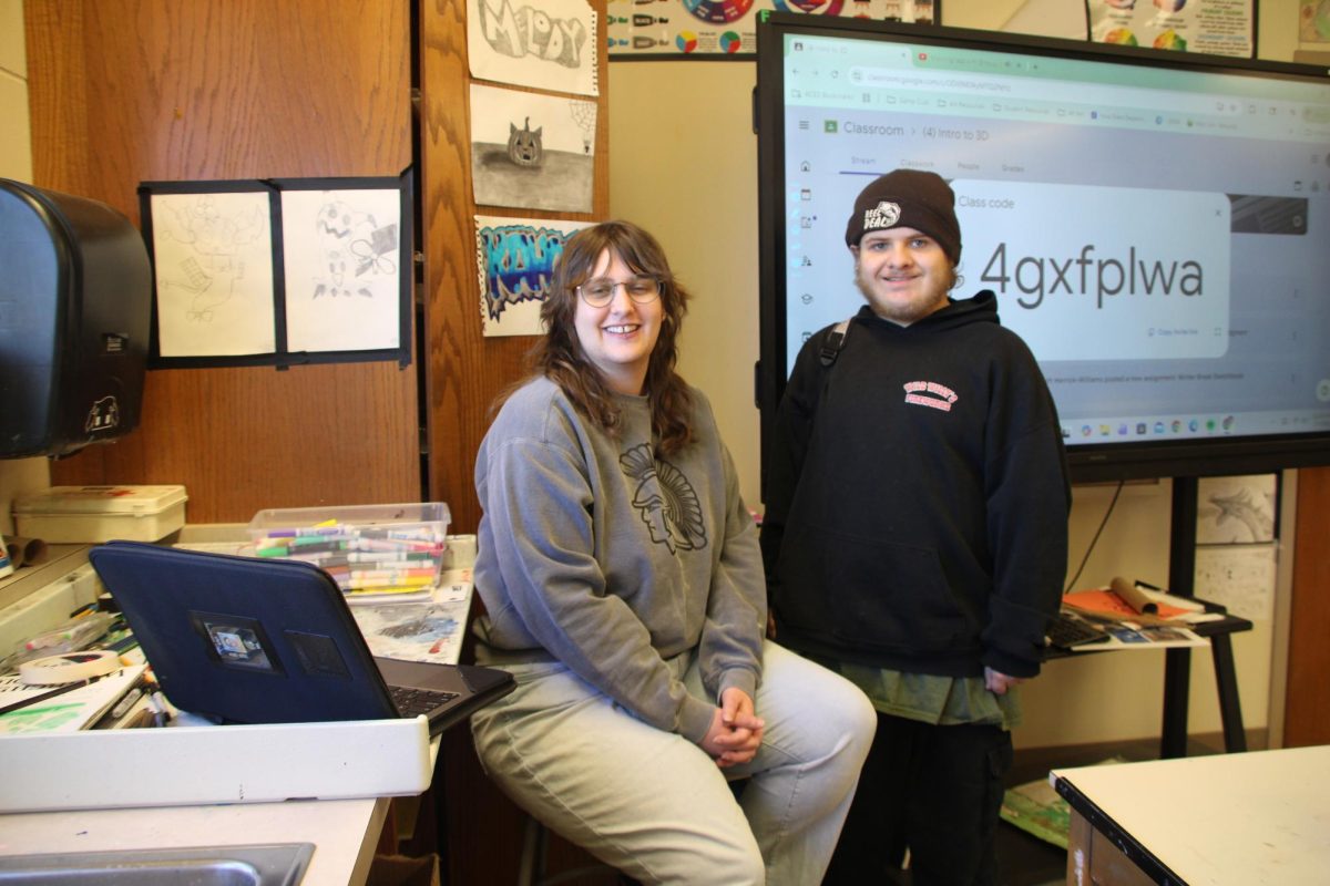 Mrs.Herrick-Williams (left) with a student, Austin Coatney (right)